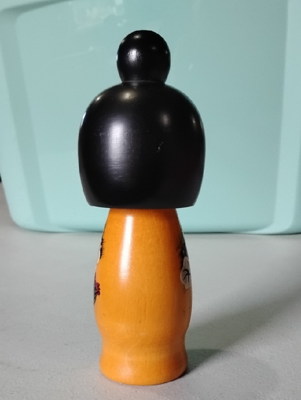 Hand-Painted Wooden Orange Kokeshi Doll with Black Hair - Classic Japanese Style - Picture 5 of 7